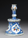 Candlestick with tulip blossoms