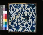 Tile with floral decoration
