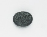 Oval bezel seal with nasta‘liq inscription and floral decoration