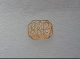 Octagonal bezel amulet with thuluth inscription and linear decoration