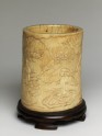 Ivory brush pot with figures in a landscape