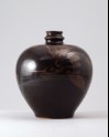 Black ware vase with two birds