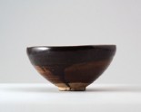 Black ware bowl with 'oil spot' glazes