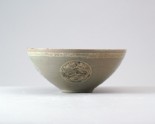 Greenware bowl with dragons and a flower