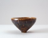 Black ware bowl with russet iron splashes