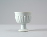 White ware stem cup with petal decoration