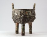 Ritual food vessel, or ding, with taotie mask pattern