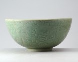 Greenware bowl with lotus flowers and waves