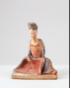 Figure of female attendant with a winnowing basket