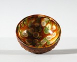 Bowl with floral decoration and a three colour glaze