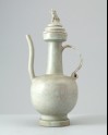 White ware ewer and lid surmounted by a lion