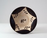 Black ware bowl with leaf decoration