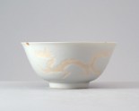 White ware bowl with dragons chasing flaming pearls
