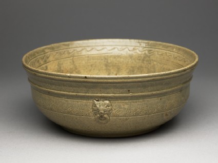 Greenware bowl with bands of decorationoblique