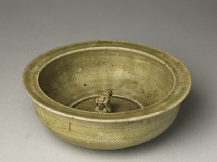 Greenware basin with small kneeling figureoblique