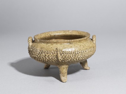 Greenware tripod bowl with impressed decorationoblique