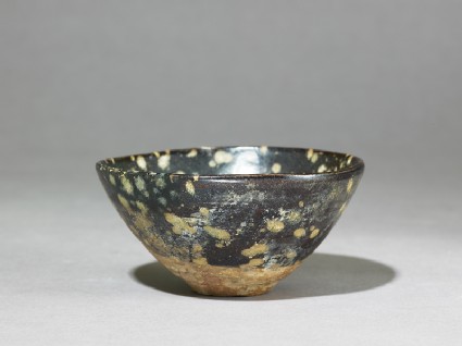 Black ware tea bowl with 'tortoiseshell' glazesoblique