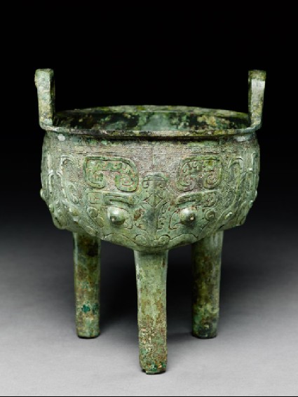 Ritual food vessel, or ding, with dragon and taotie masksoblique