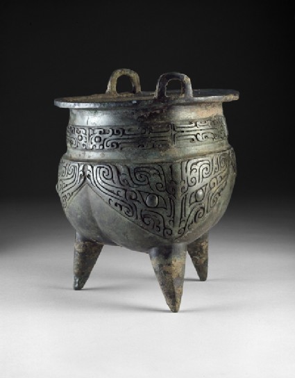 Ritual food vessel, or li ding, with taotie masksside