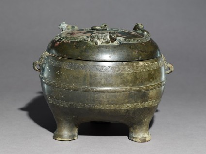 Ritual food vessel, or ding, with seated ox on the lidoblique