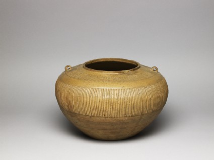 Greenware jar with ribbed decorationoblique