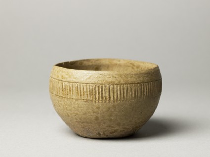 Greenware bowl with ribbed decorationoblique