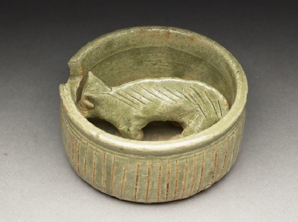 Greenware burial figure of pig in a penoblique