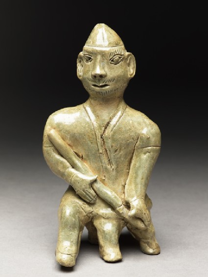 Greenware burial figure of man holding a stafffront