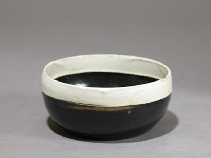 Black ware bowl with white rimoblique