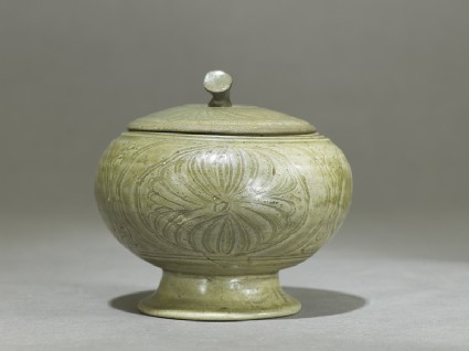 Globular greenware jar with lotus flower decorationside