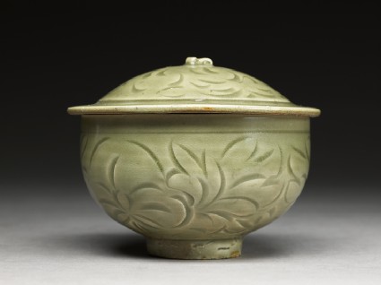 Greenware bowl with floral designside