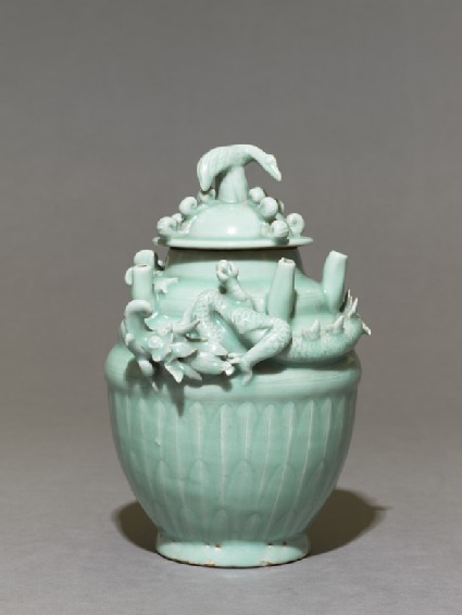 Greenware funerary jar with dragonside