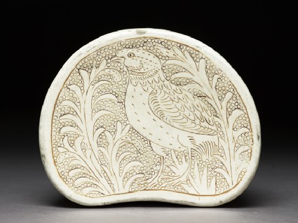 Cizhou type pillow with a bird amid foliagetop