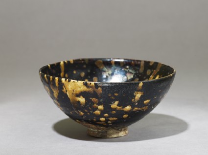 Black ware tea bowl with 'tortoiseshell' glazesoblique