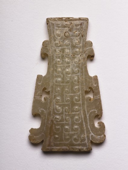 Pendant decorated with interlocking T-scrollsside