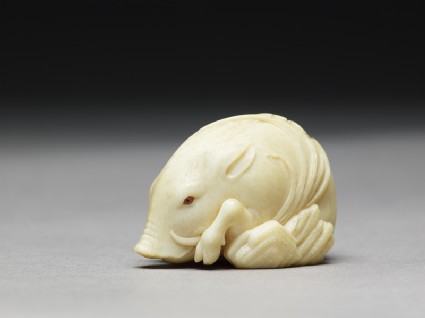 Netsuke in the form of a wild boar among grassside