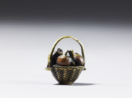 Ojime in the form of a fruit basketside