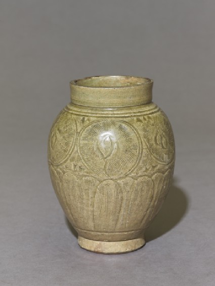 Greenware jar with lotus petals and peony scroll decorationoblique