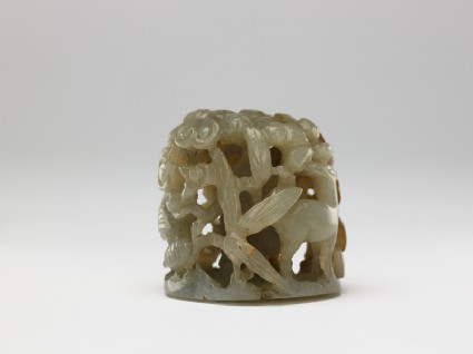 Jade finial with deer, birds, and treesside