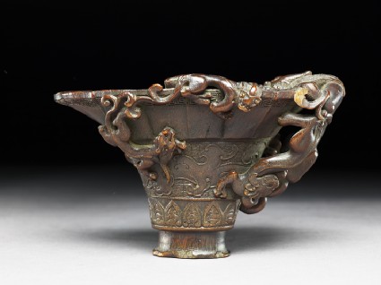 Rhinoceros horn libation cup with bronze-style decorationside