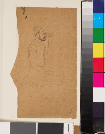 Seated man with light beard and raised handfront