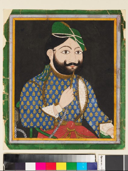 Bearded man wearing a green turbanfront