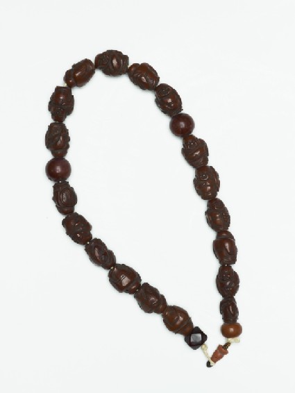 Buddhist rosary with beads in the form of monkstop