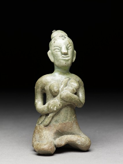 Greenware figure of mother and childside