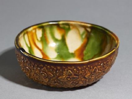 Bowl with floral decoration and three-colour glazeoblique