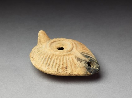 Oil lamp with moulded decorationoblique