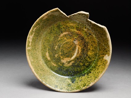 Fragment of a bowl with green glazetop