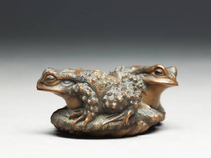 Netsuke in the form of two toads on a sandalside