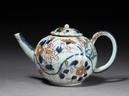 Small fluted teapot with floral decorationside