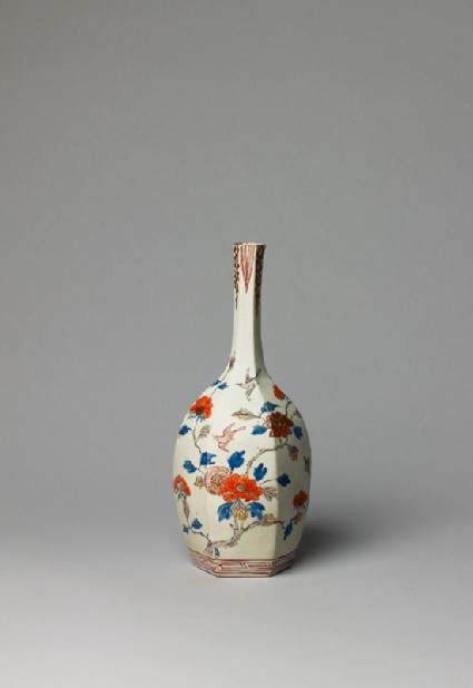 Bottle with flowers and birdsside